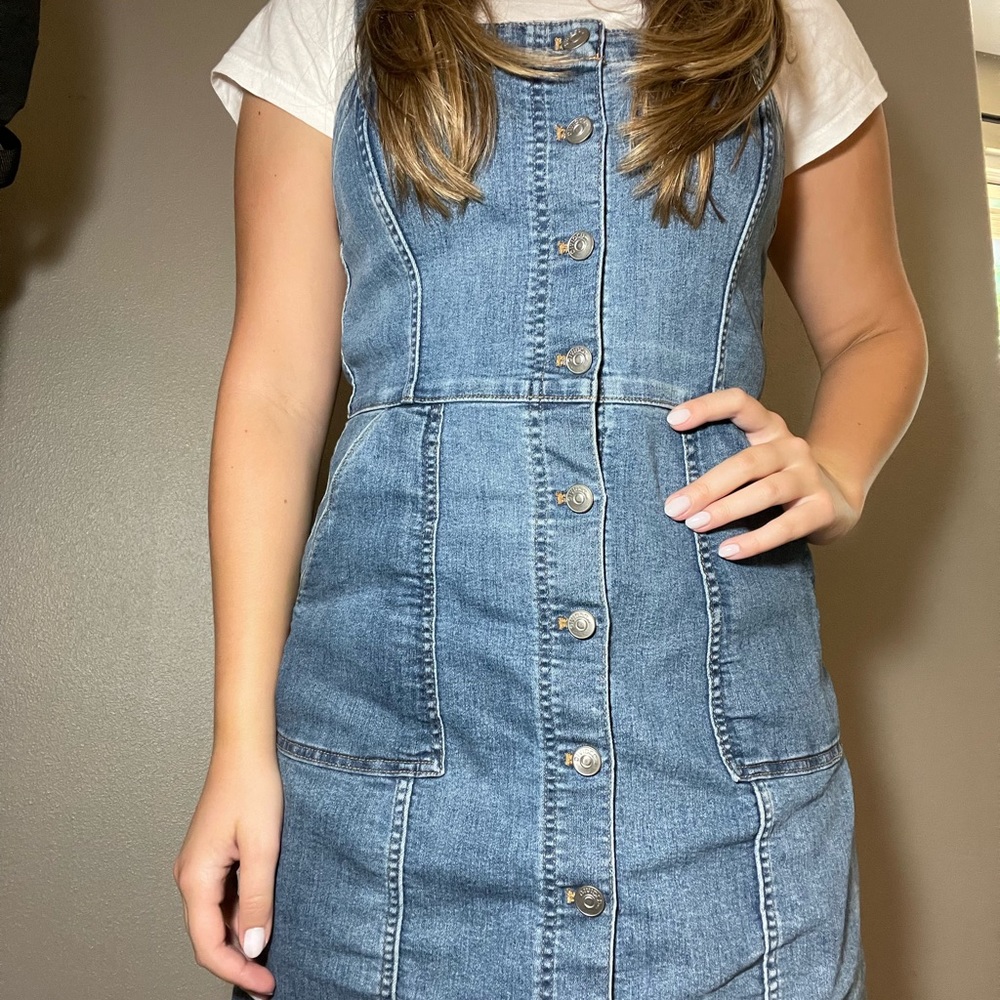 Shot jean overall dress with buttons down the center.